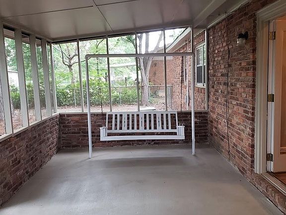 Covered & screened patio at rear of property; nice swing for your enjoyment.