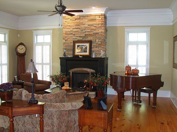 Home features two stone fireplaces.