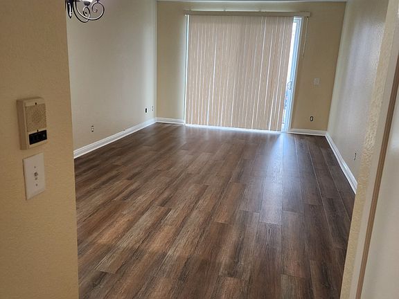 Living Room with Louver Blinds to Balcony Patio