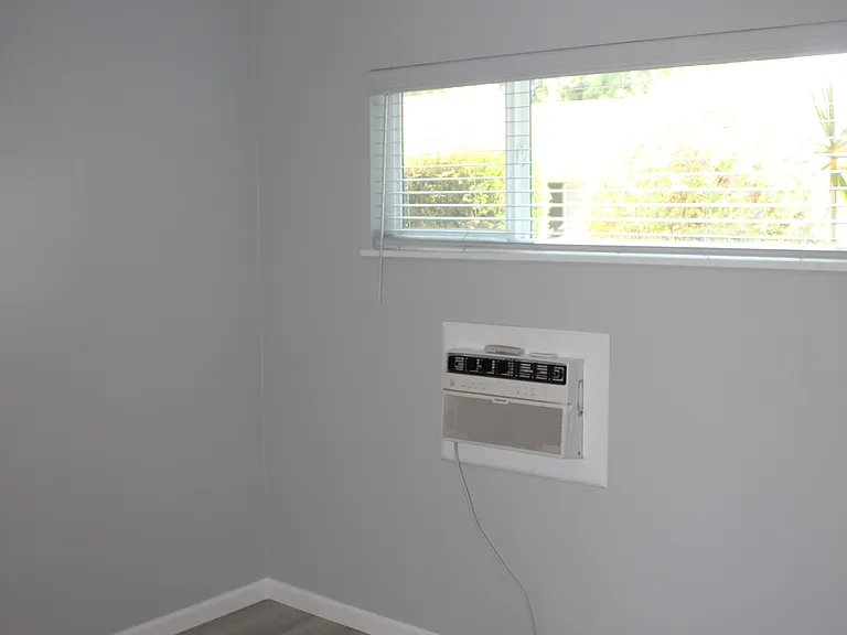 Bedroom AC unit plus a ceiling fan for added comfort