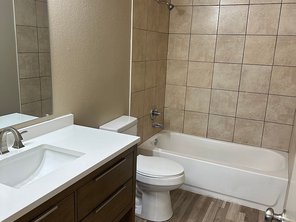 Bathroom with new vanity, lighting and flooring