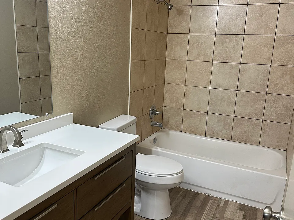 Bathroom with new vanity, lighting and flooring