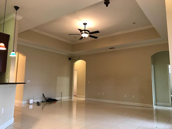 living room with high & tray ceilings