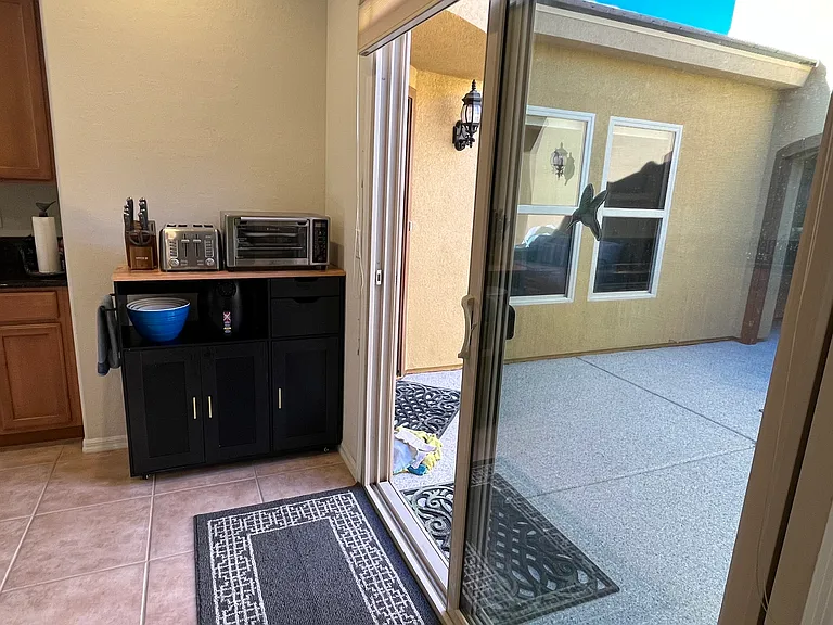 sliders from kitchen out to Courtyard.