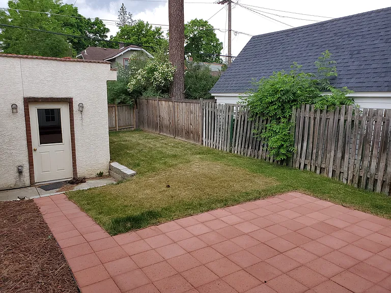 Fenced back yard, patio and garage.