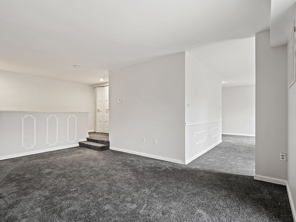 Living area looking toward entry and formal dining area to the right