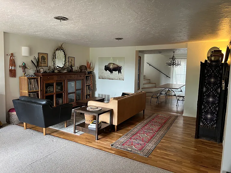 Main house living room looking into dining room