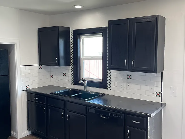 Kitchen overlooks backyard
