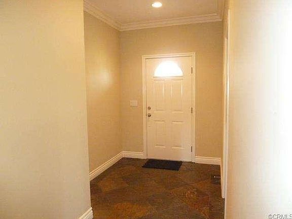 Entry foyer, quality baseboards, crown molding