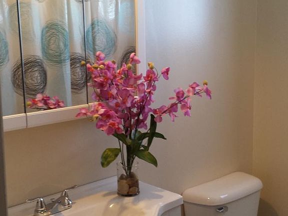 Full bathroom located on upper floor.