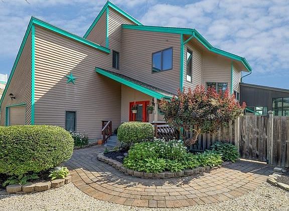Newer pavers and lush landscaping.