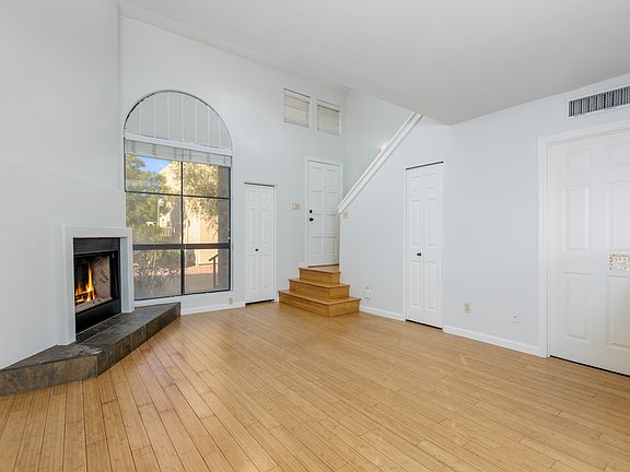 Living room, with 20 foot ceiling. 2 closets downstairs, and a guest bath.