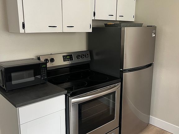Stainless steel appliances in kitchen.