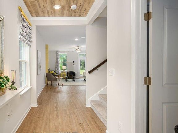 Foyer leads to main living space Photo is a representation of home.