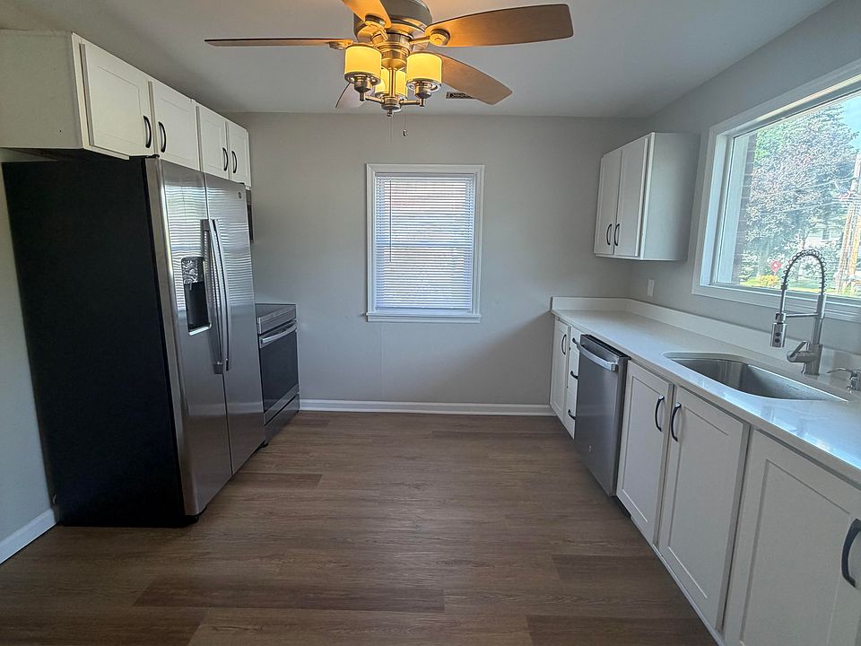 Large kitchen with brand new stainless steel appliances, quartz counter tops, pantry, Plenty of space for a table and chairs