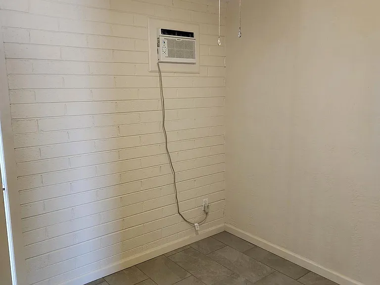 Bed 1 - ceiling fan + wall unit keeps you cool!