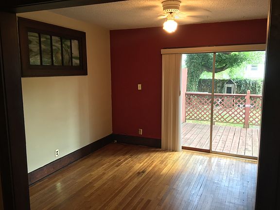 Dining room with acces to large deck and fenced in backyard.