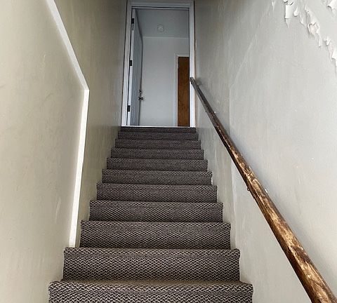 The rest of the apartment is located at the top of this privately accessed stairway.