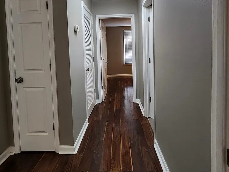 Hallway to Half Bath and Bedroom 2, Coat Closet
