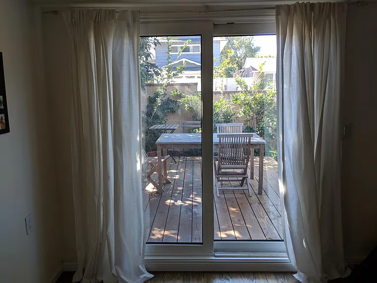Sliding glass door into the backyard from the den/bonus room.