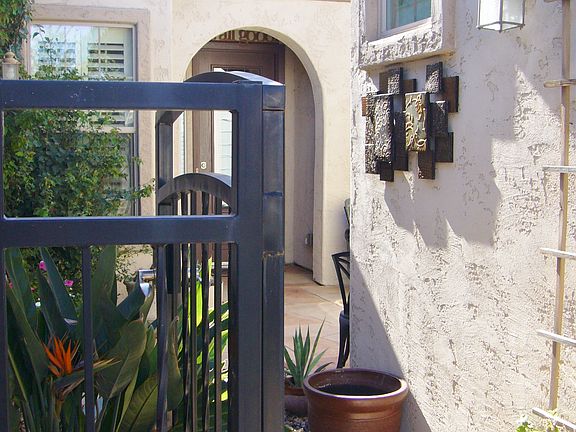 Gated walkway to courtyard.