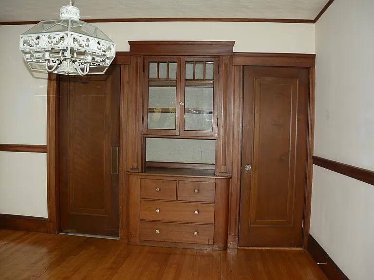 dining room (C side)
Doors on Hutch's two sides 
 
left swing door via butler's pantry to kitchen's B side counter; right door access to bath, both bedrooms and kitchen door near its A & D corner