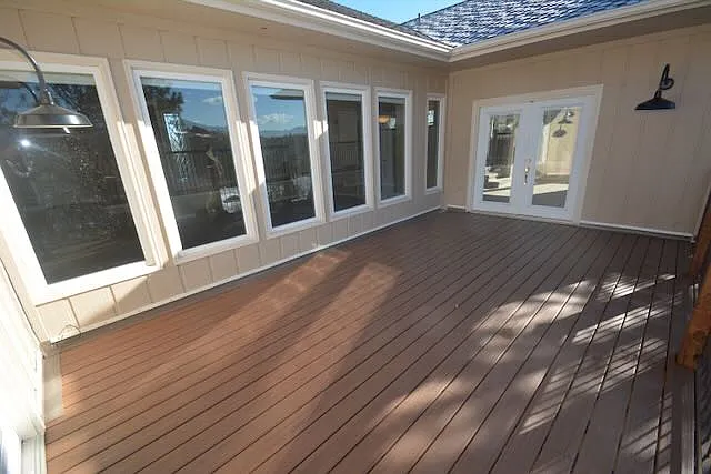 deck and doors to fireplace room