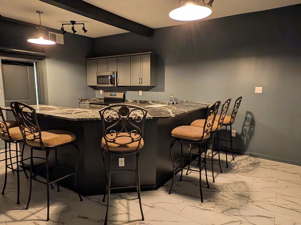 New Kitchen with Granite Bar Top and Counter including Bar Stools.