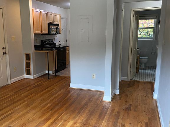 Looking from living room to kitchen and bathroom. Bedrooms are to the right.