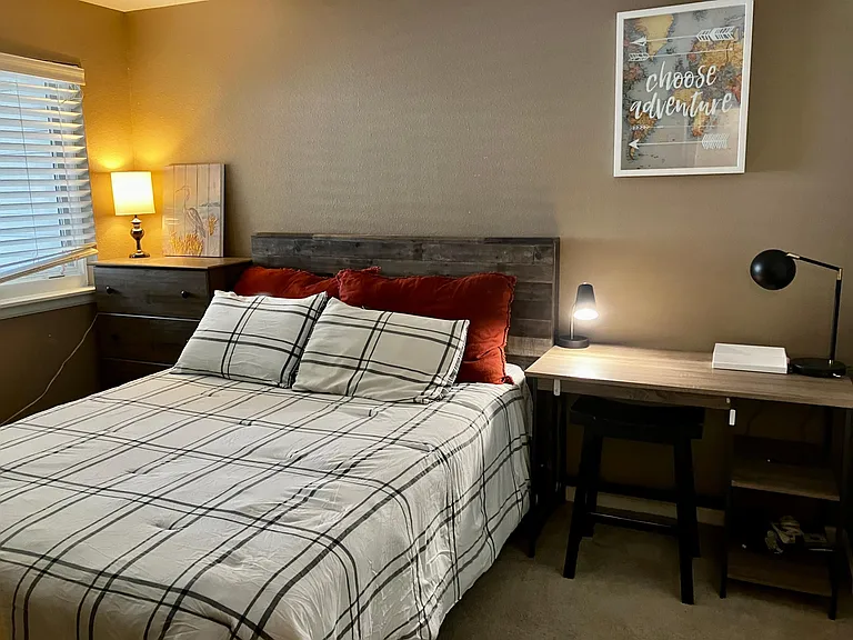 The second bedroom has a desk, chair and dedicated work area along with a great new queen size bed
