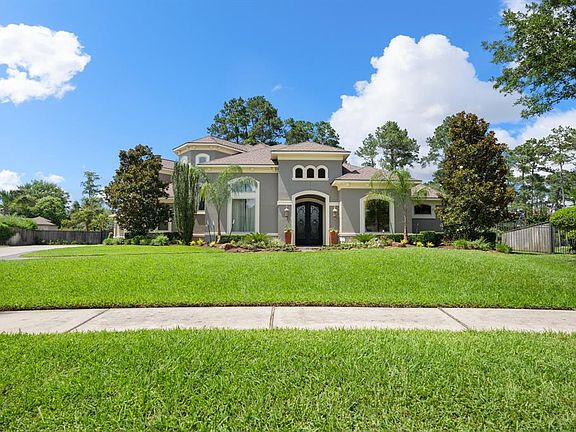 A Mediterranean Stucco style custom home positioned perfectly on a cul-de-sac Golf Course lot in Gated Manor Estates with a 3-car oversized garage and double wide driveway.