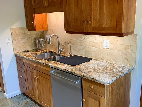 Kitchen granite countertop and Grohe faucet, cherry cabinets