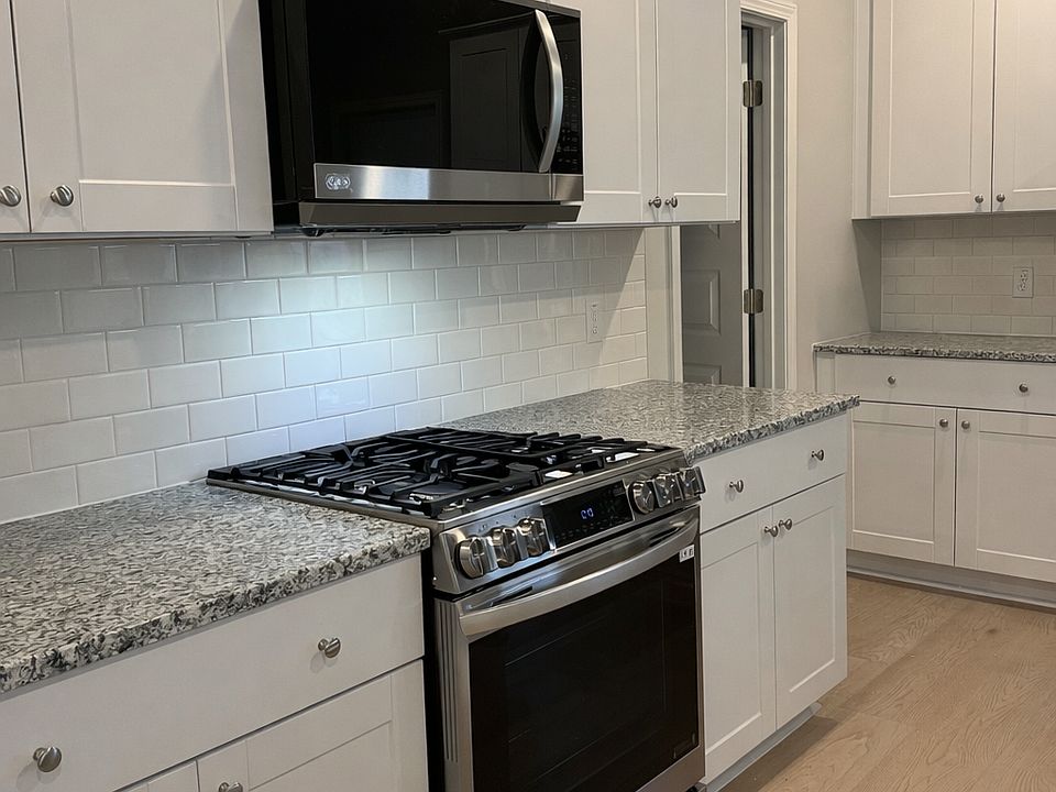 Beautiful natural gas range and over the range microwave in stainless steel finish.