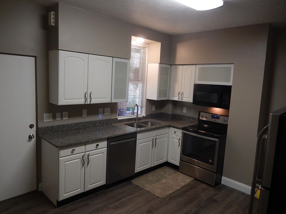 Kitchen Granite Covered Counter tops with new stainless steel appliances, Eat in Kitchen
