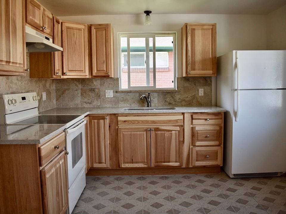 Updated Kitchen with new cabinets, backsplash and quartz countertop