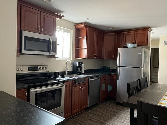 The appliances are 2-1/2 years old, as is the apartment itself. Refrigerator, stove, dishwasher and microwave included.