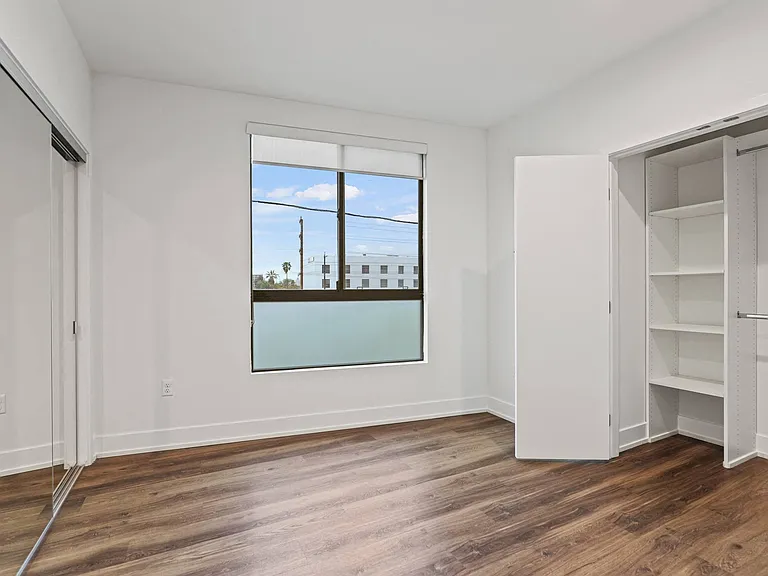 Bedroom with Two Closets and Windows