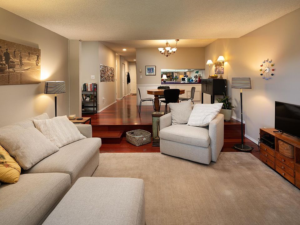 open floor plan. as you enter the condo the first bedroom is on the west/(left in this picture) side of the front door and the office is on the right. next is the guest bathroom and laundry which are across from the kitchen. the dining room then leads to