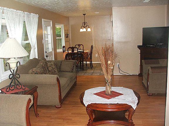 View from one end of the living room with the open dining area.