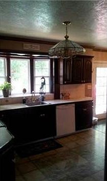 great kitchen sink window, new knobs on cabinets