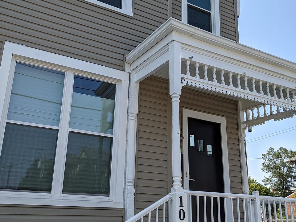 Welcome home! Exterior view of 1083 front door and facade - 1083 is the right side of the duplex. Corner lot; the streets are typically not very busy during the day/at night, though there is a pickup in activity around rush hour.