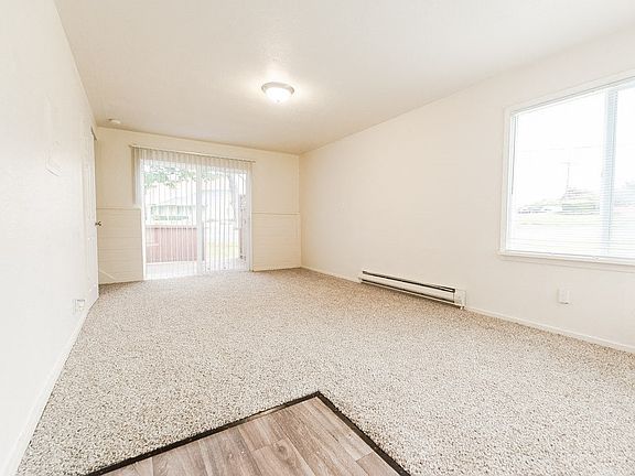 Lakewood Apartments - Pacific Walk Apartments - Entryway, Living Room, and Deck