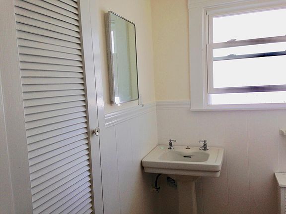 upstairs bathroom with cabinet