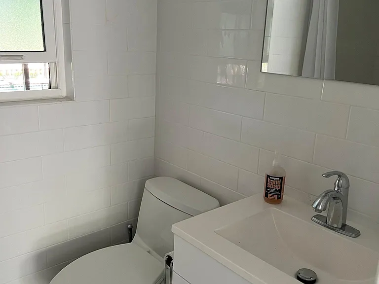 pool accessed bathroom with shower.