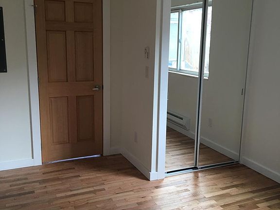 Bedroom with mirrored closet