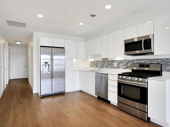 Hardwood floors throughout, open concept, gas cooking, quartz countertops and beautiful views.