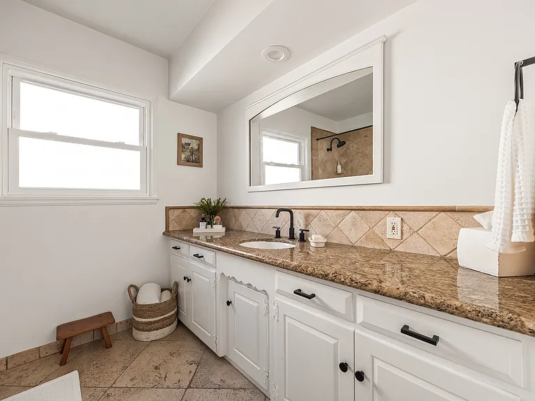 Guest bathroom featuring a tub and shower combination.