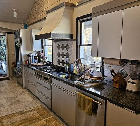 Kitchen has high end appliances and heated floors