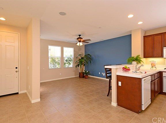 Bright open spaces are enhanced by recessed lighting which illuminates entry and work areas.  Your guests can sit at the breakfast bar and enjoy a cup of coffee or a glass of wine while meal preparation is in process.