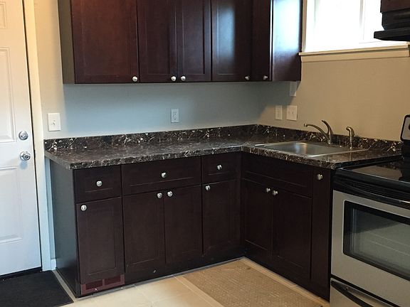 Beautiful kitchen cabinets with built in spice rack and soft